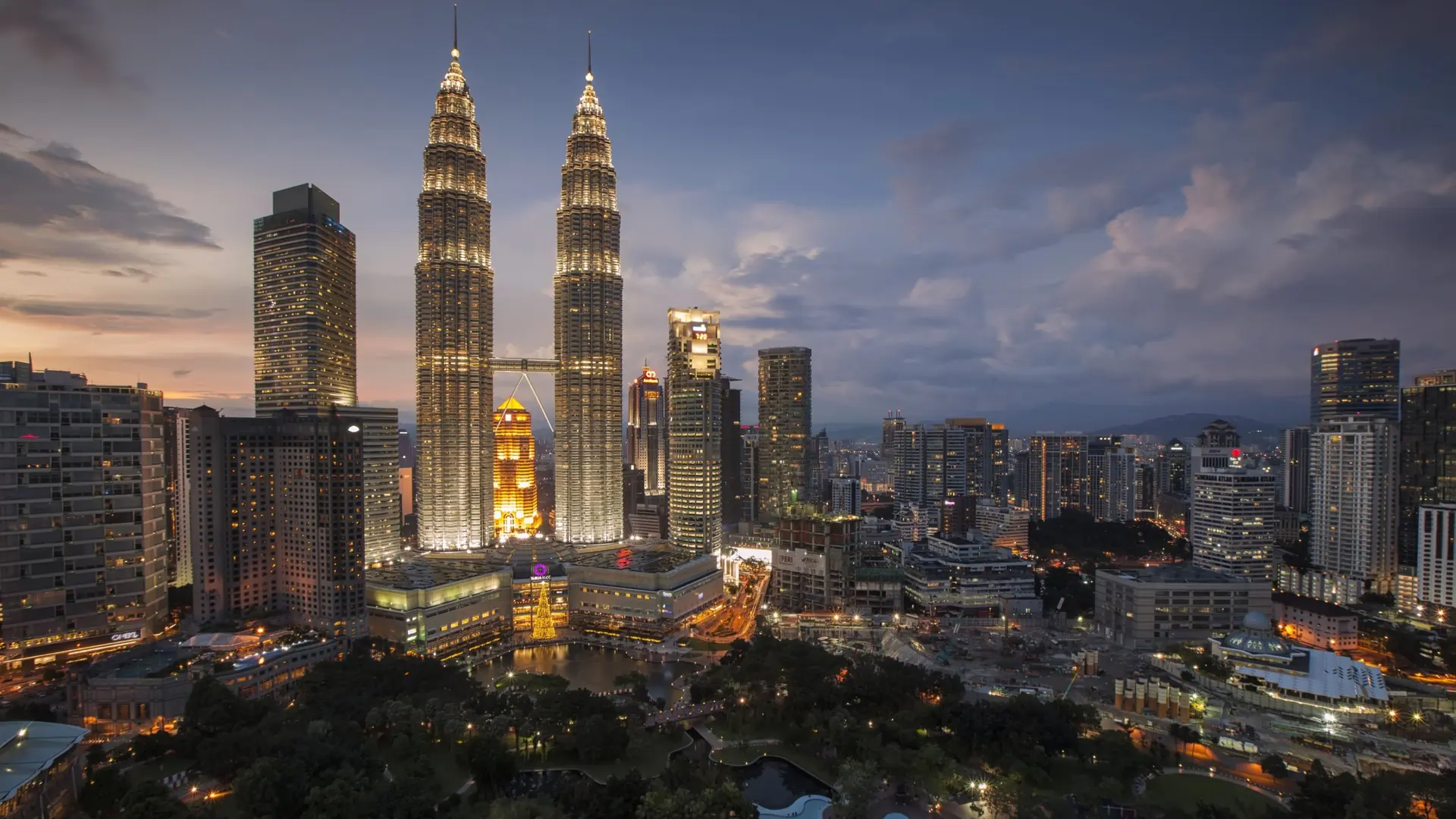 The twin towers and skyscrapers of Kuala Lumpur at dusk, Malaysia